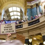 Abortion rights supporters rally at the Bigger Than Roe National Mobilization March in the rotunda of the Wisconsin State Capitol.