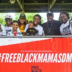 New mom Leara Davis (center) attends a community party hosted by the Free Black Mamas DMV coalition.