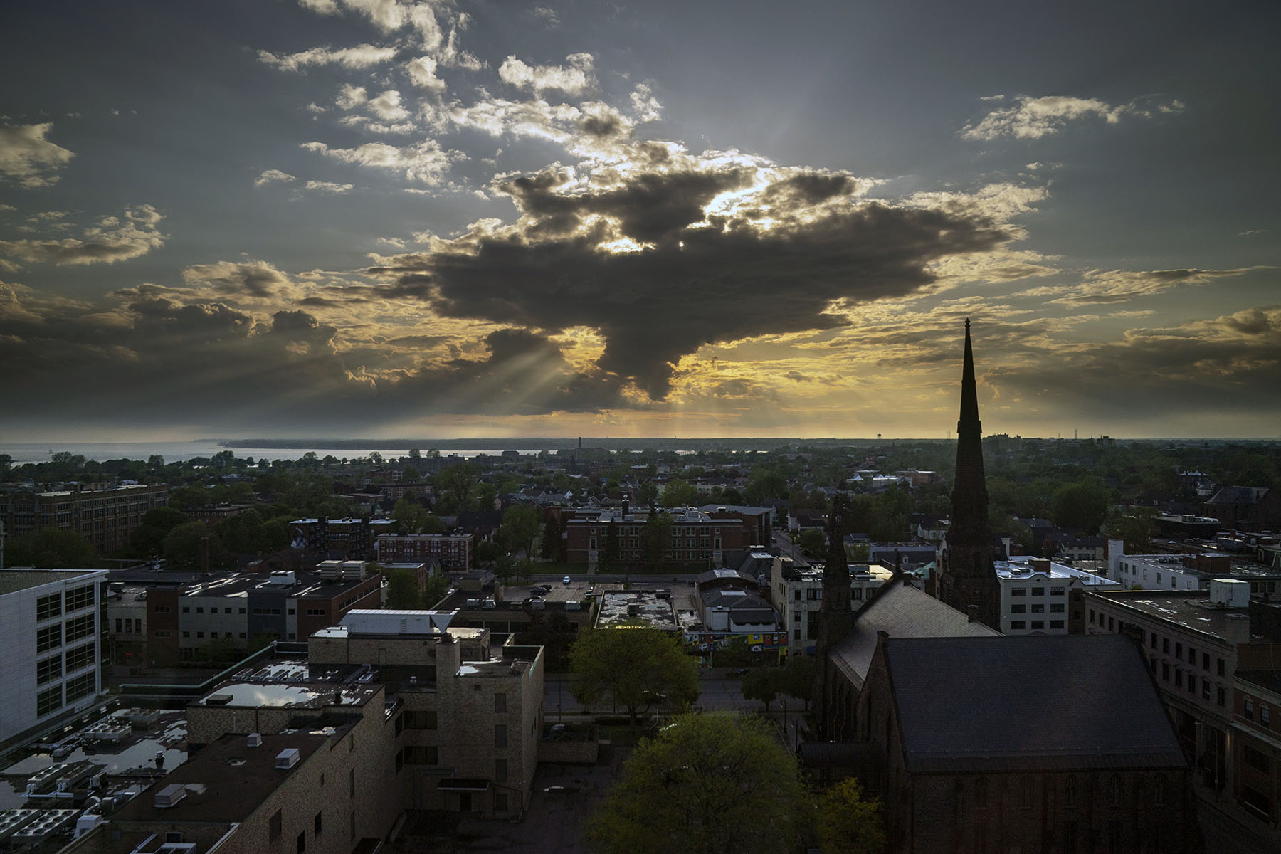 The sun peeks through the clouds over Lake Eerie just east of downtown Buffalo, New York.