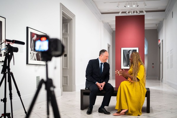 Doug Emhoff laughs as he speaks with 19th editor-at-large Errin Haines at the National Portrait Gallery in Washington, D.C.