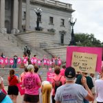 Protesters gather outside the state house in opposition to a proposed abortion ban.