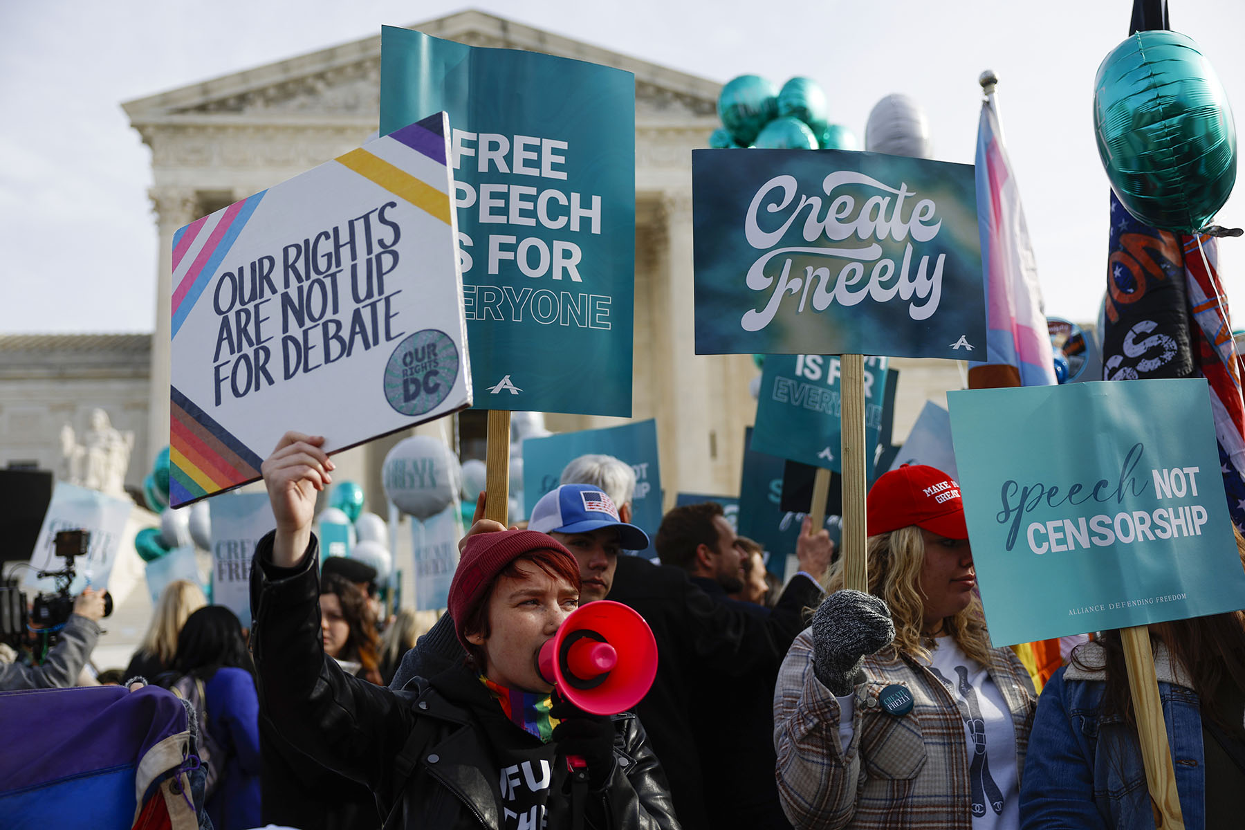 Supporters of web designer Lorie Smith and counter-protesters demonstrate in front of the Supreme Court in December 2022 in Washington, D.C.