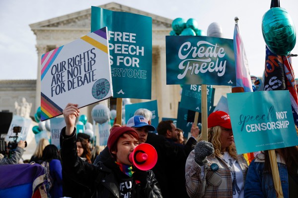 Supporters of web designer Lorie Smith and counter-protesters demonstrate in front of the Supreme Court in December 2022 in Washington, D.C.