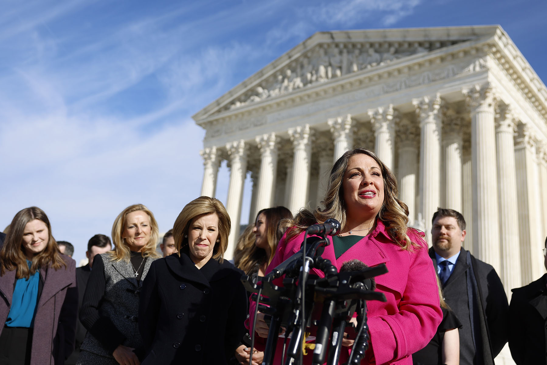 Lorie Smith speaks to reporters outside of the Supreme Court.