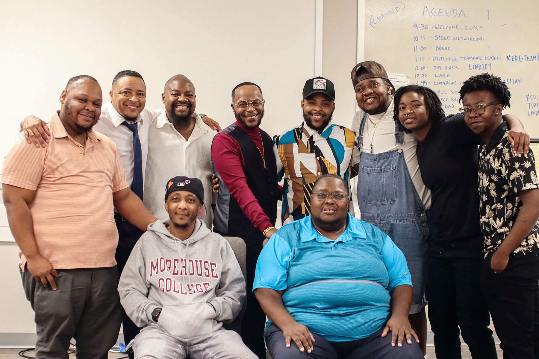 Group photo of Black trans men posing for a group photo after the Transgender Justice Initiative's workshop.