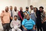 Group photo of Black trans men posing for a group photo after the Transgender Justice Initiative's workshop.