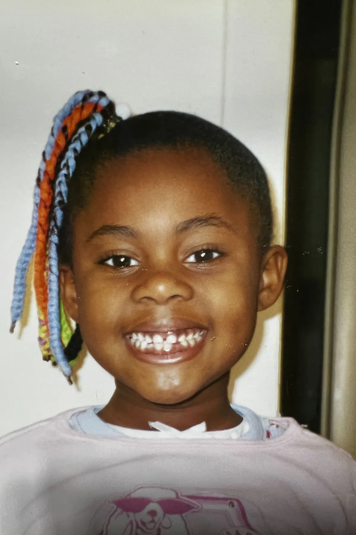 A 7-year-old Bria Herbert smiles as she shows off her hairstyle for "crazy hair day" at school.