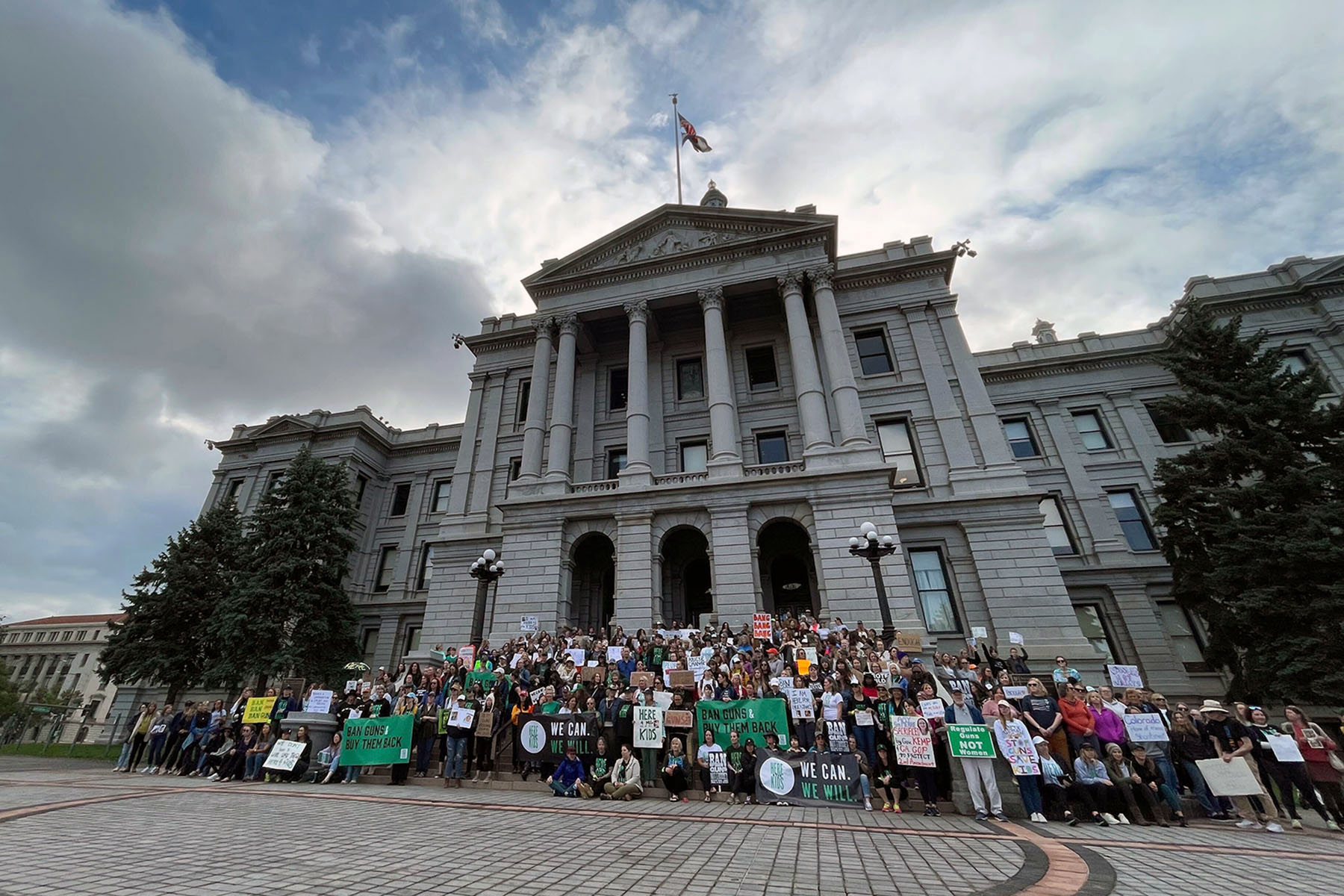 Participants in the sit-in take a group picture at the Colorado State Capitol on June 5, 2023.