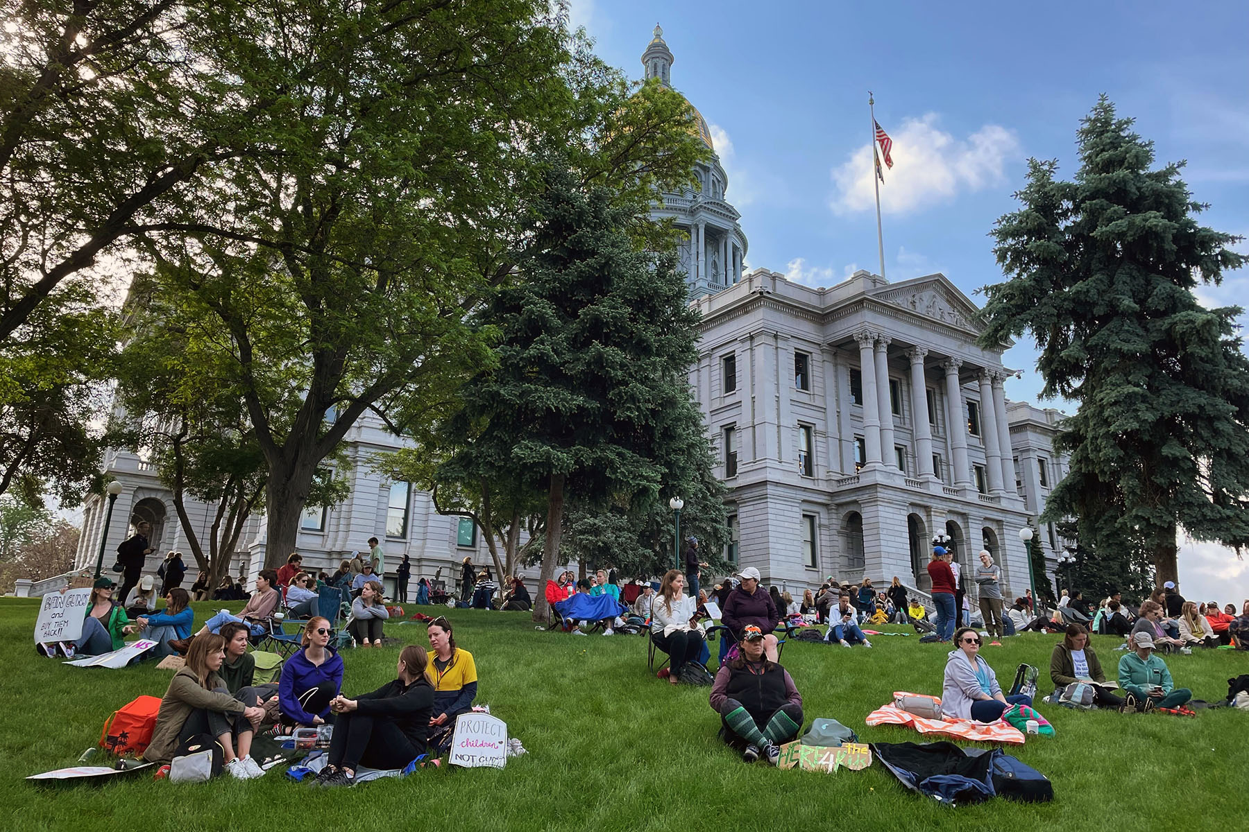 People participate in a sit-in at the Colorado State Capitol organized by Here 4 The Kids, a group founded by women of color that opposes gun violence and white supremacy,