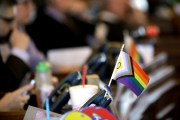 A small pride flag decorates a desk on the Democratic side of the Kansas House of Representatives in Topeka, Kansas.