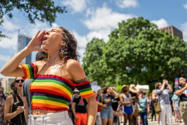 A person chants at the Texas State Capitol during a Queer March demonstration in Austin.