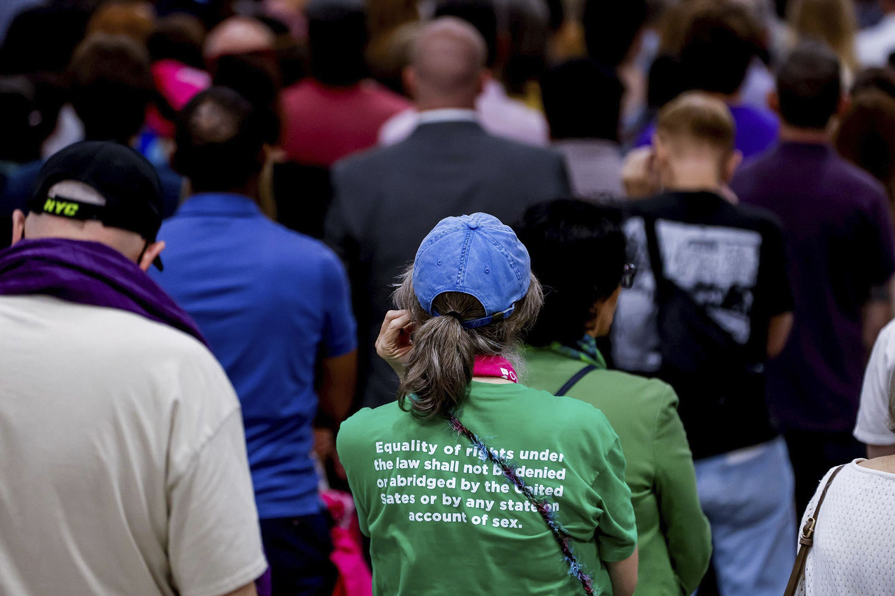 A woman listens to Vice President Kamala Harris speak on the one year anniversary of the Supreme Court's Dobbs decision in Charlotte, North Carolina.