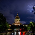 Lightning flashes behind the Texas State Capitol in April 2023 in Austin, Texas.