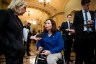 Tammy Duckworth speaks to members of the press on Capitol Hill.