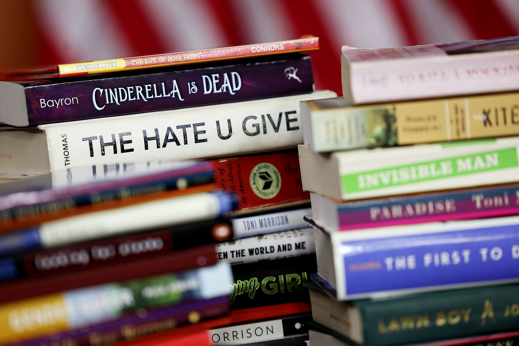 Copies of banned books from various states and school systems from around the county are seen during a press conference on Capitol Hill.