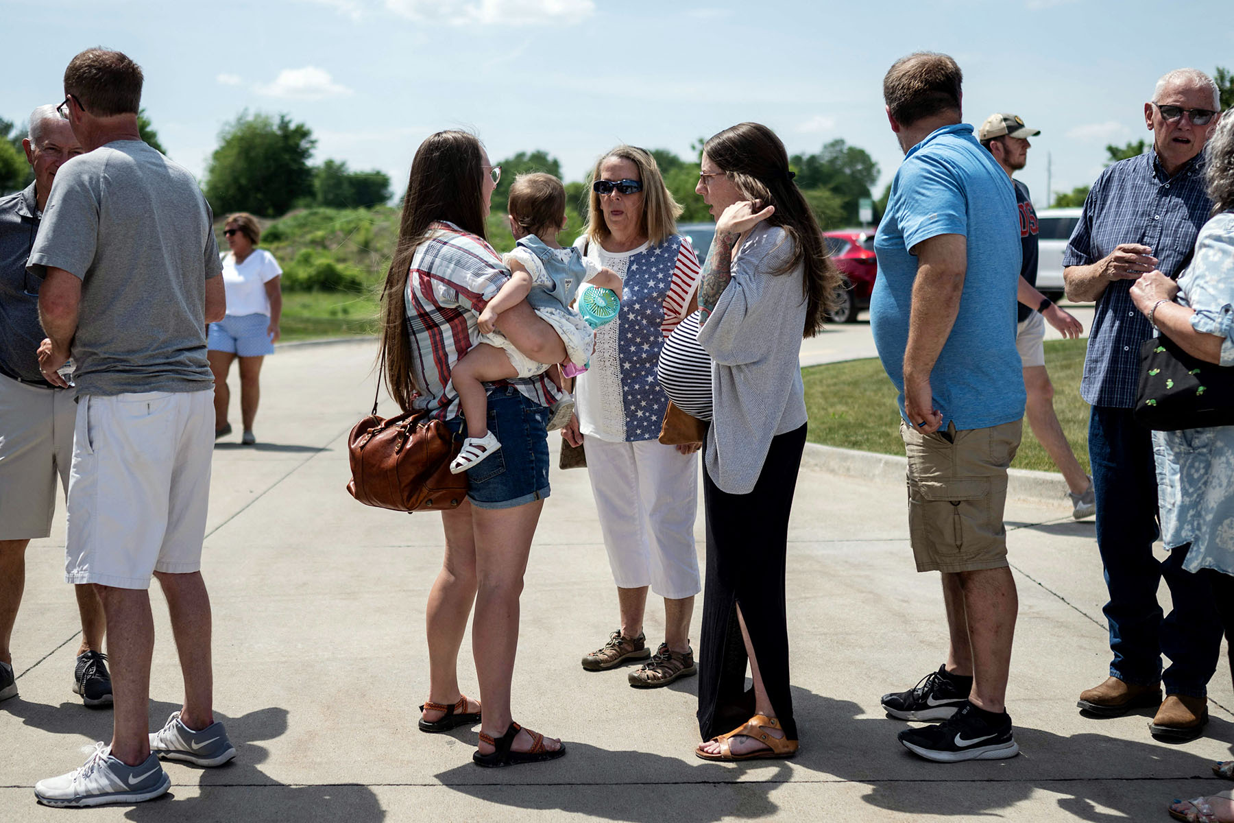 Women supporters wait in line for a campaign event with Gov. Ron DeSantis in Pella, Iowa, in May 2023.