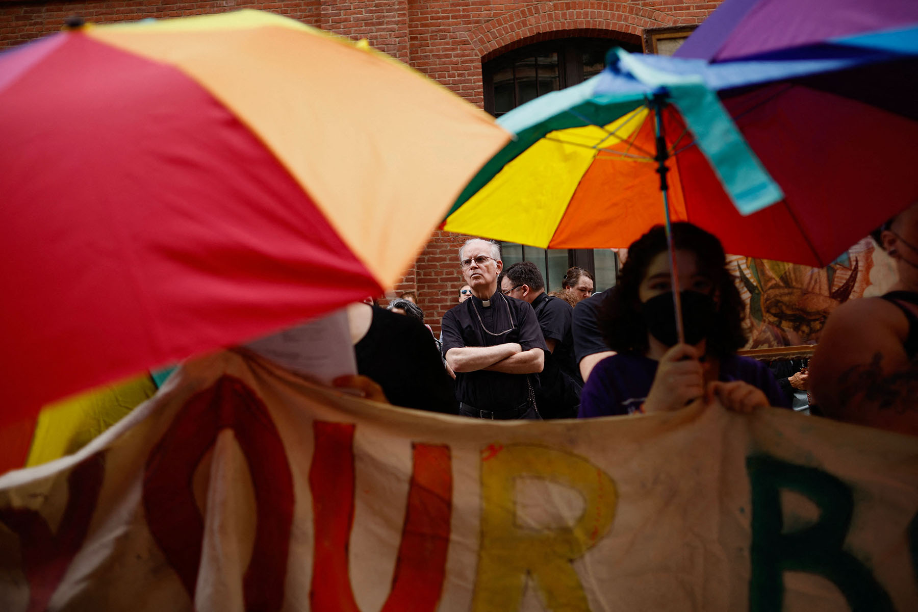 Abortion rights activists block members of a religious group as they pray in front of a Planned Parenthood clinic.