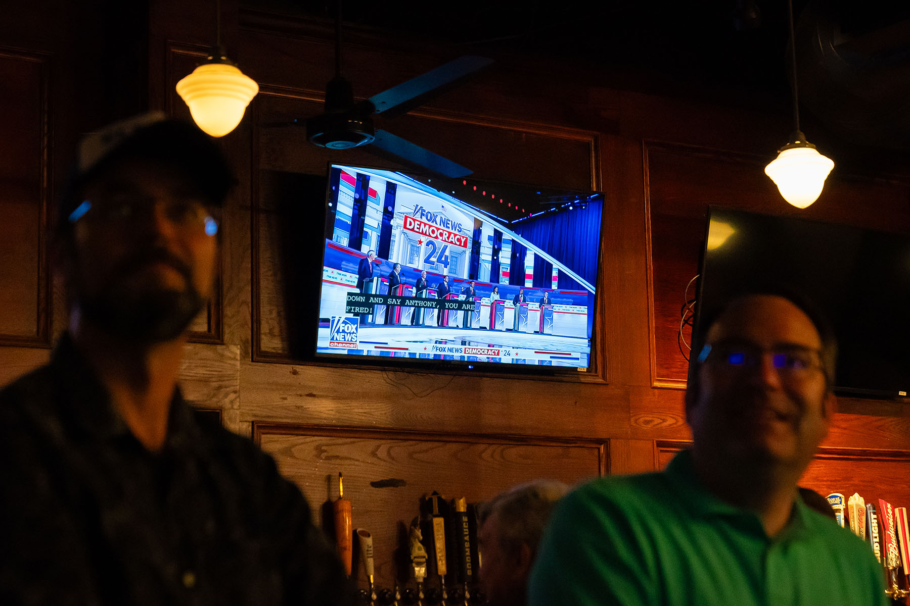 The Republican Presidential Primary debate plays on a TV screen at a bar.