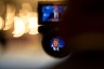 President Trump is seen giving a speech through a camera eyepiece.