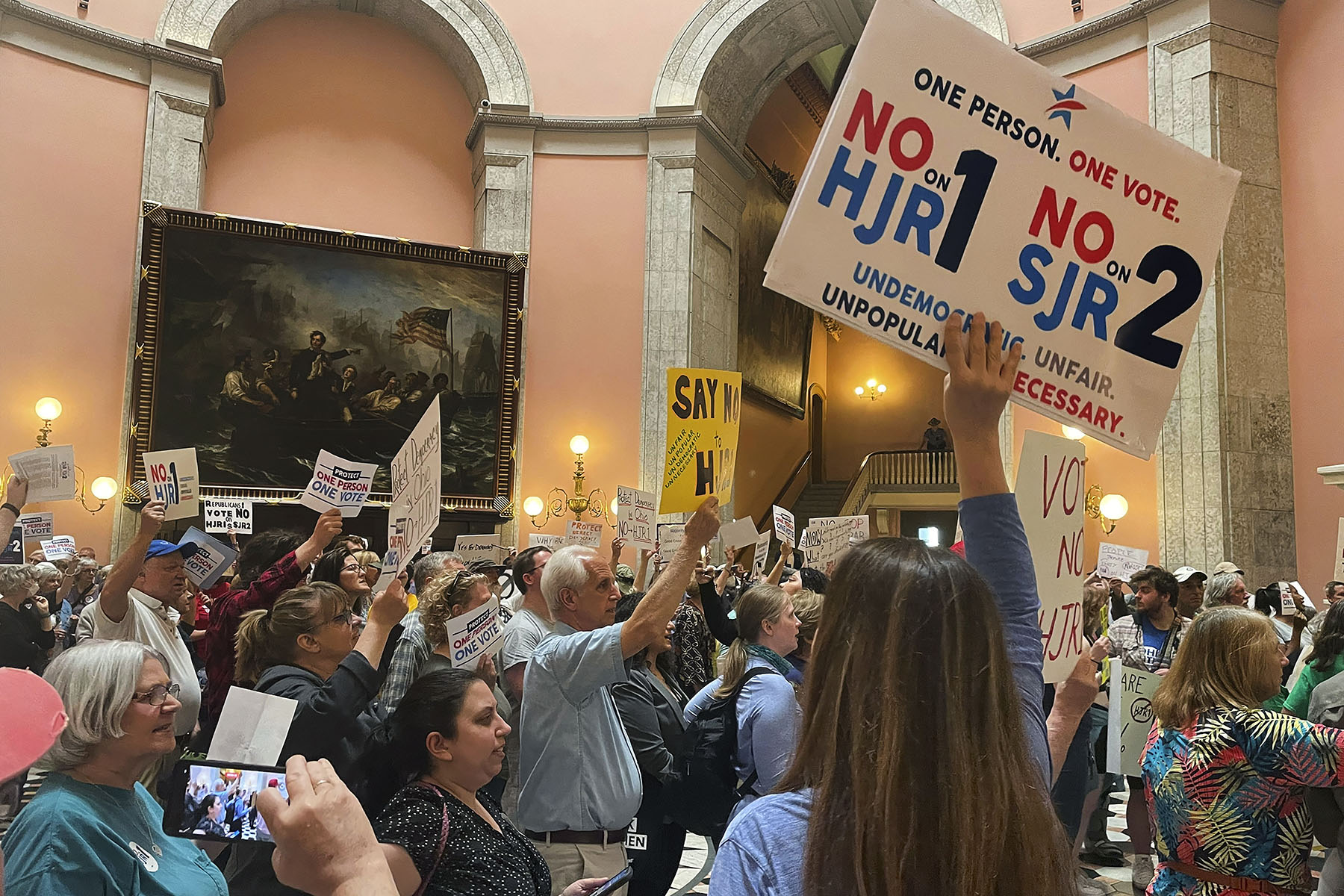 Supporters and opponents of a GOP-backed measure that would make it harder to amend the Ohio constitution pack the statehouse rotunda.