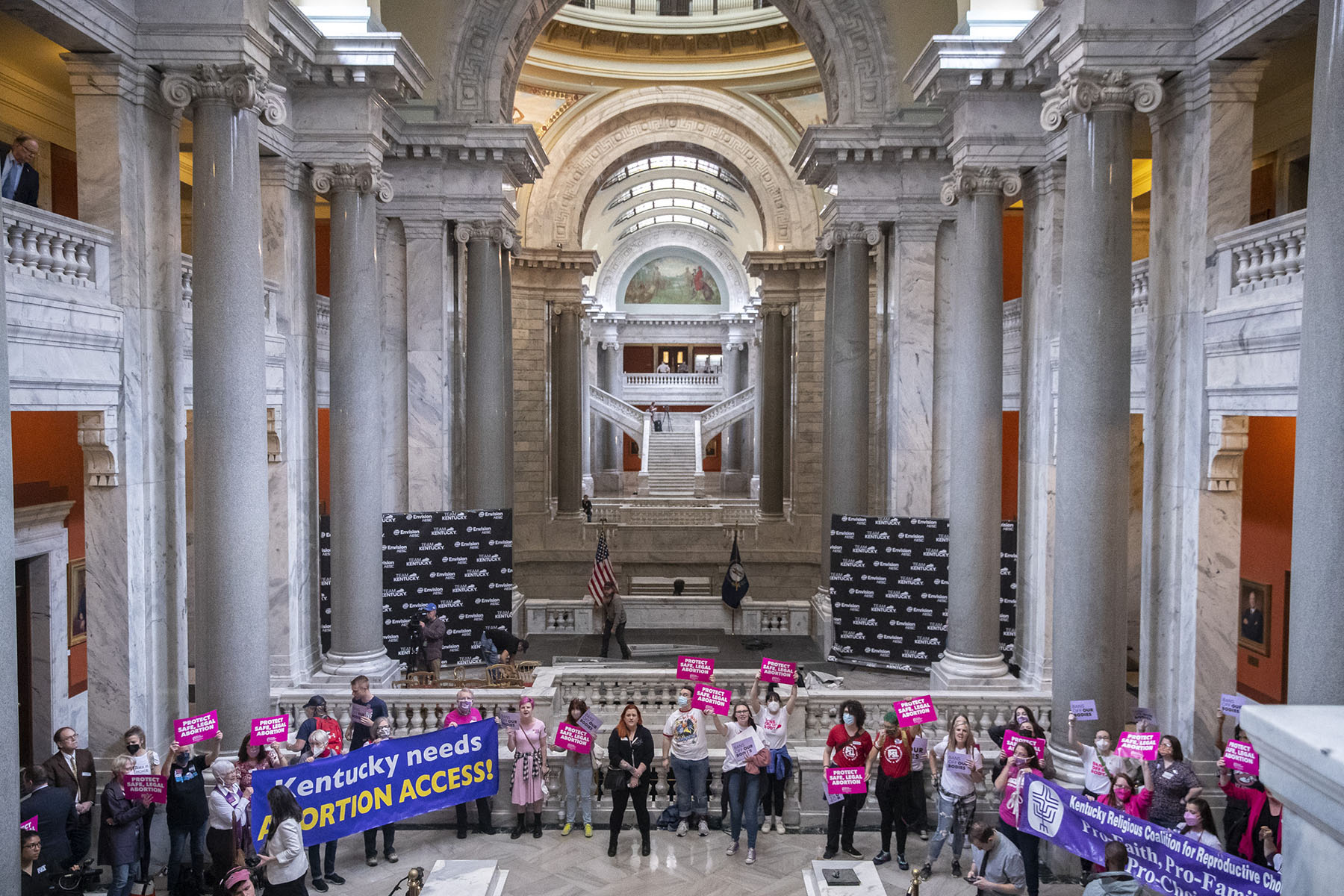 Abortion rights demonstrators holding signs gather at the Kentucky State Capitol.