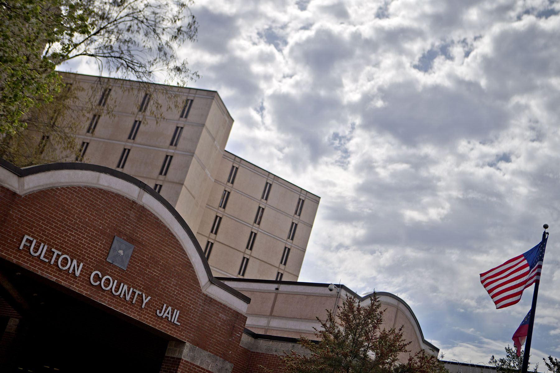 Fulton Country Jail is seen in Atlanta, Georgia. An American flag flies on the right side of the image.