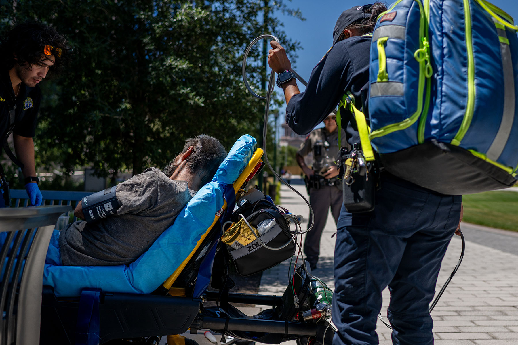 Austin-Travis County EMT assist a patient found passed out and dehydrated near the Texas State Capitol.