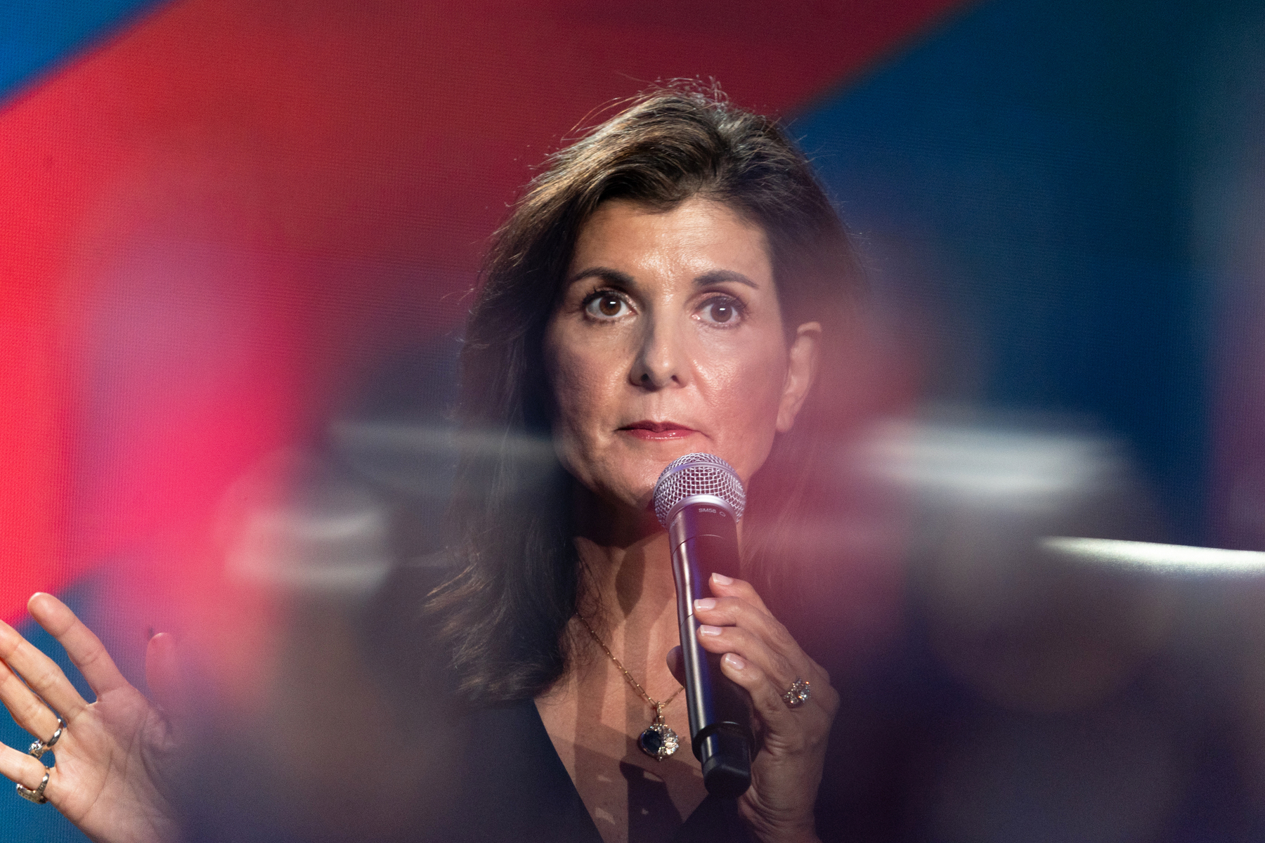Republican U.S. presidential candidate Nikki Haley holds a microphone at an event.