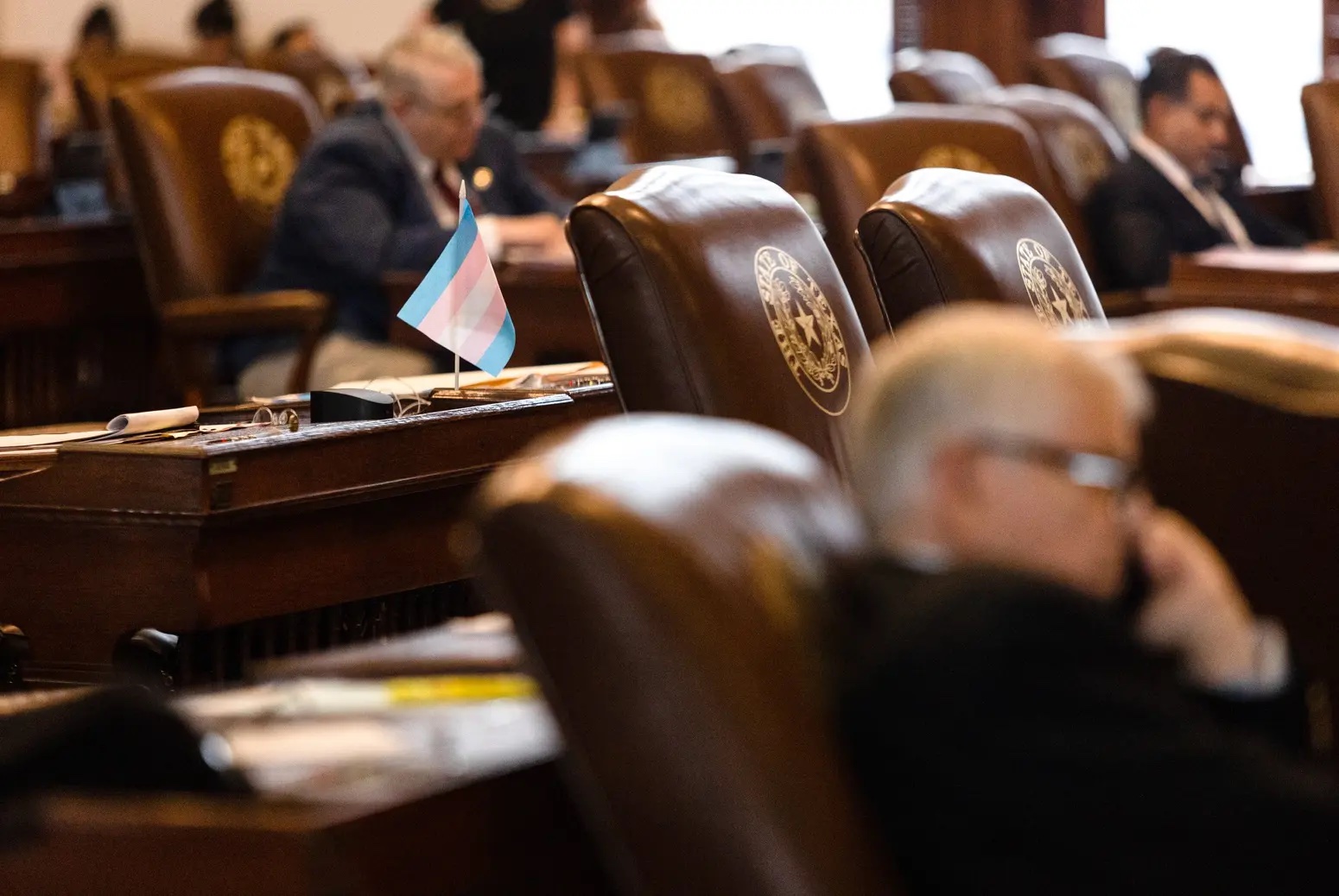 A transgender pride flag sits on the desk of Texas lawmakers.