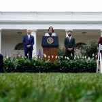Vice President Kamala Harris speaks about gun safety from the Rose Garden of the White House. Besides her are President Joe Biden and Rep. Maxwell Frost.