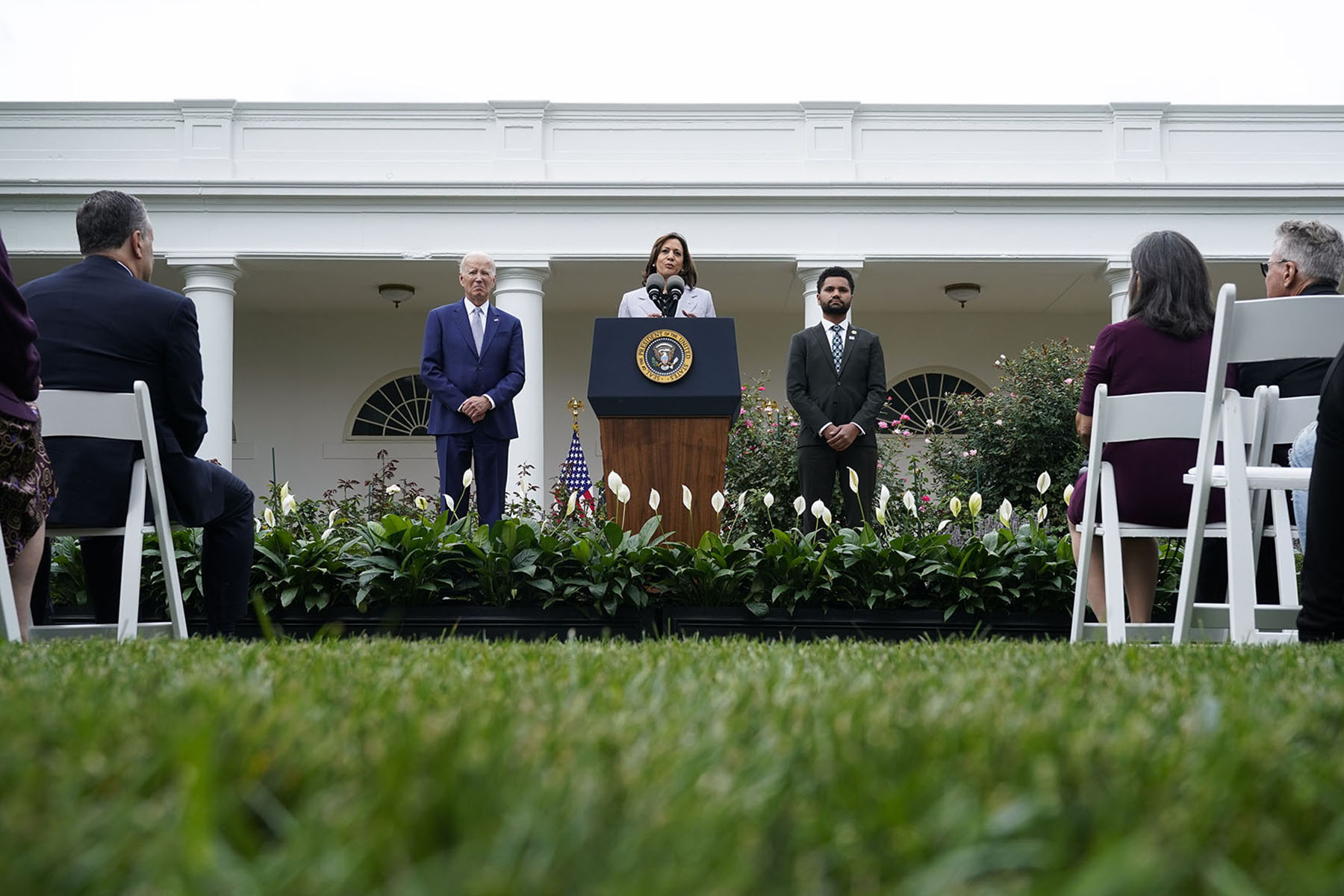 Vice President Kamala Harris speaks about gun safety from the Rose Garden of the White House. Besides her are President Joe Biden and Rep. Maxwell Frost.