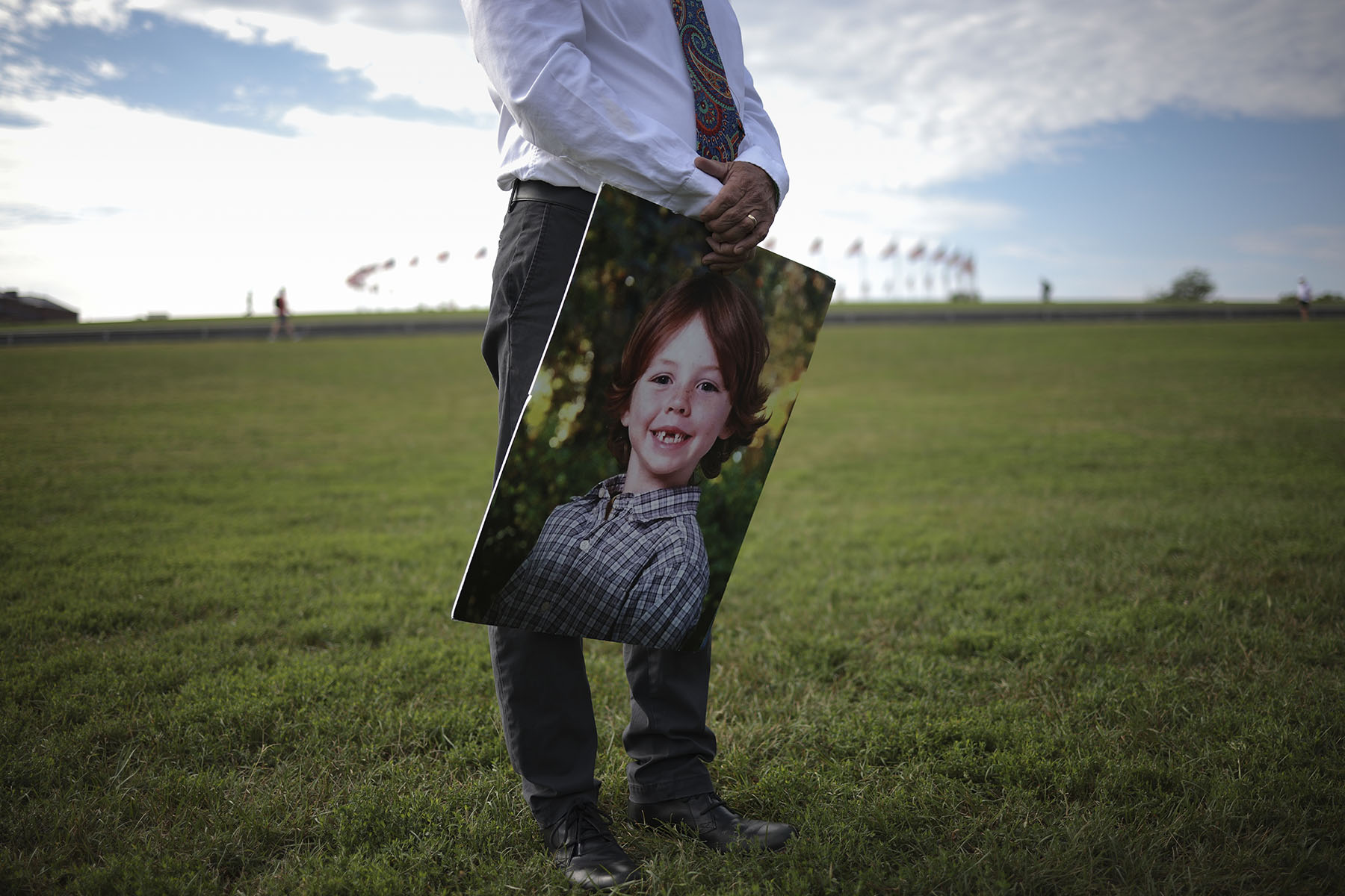 Mark Barden holds a picture of his son on the national mall during a call for action on preventing gun violence.