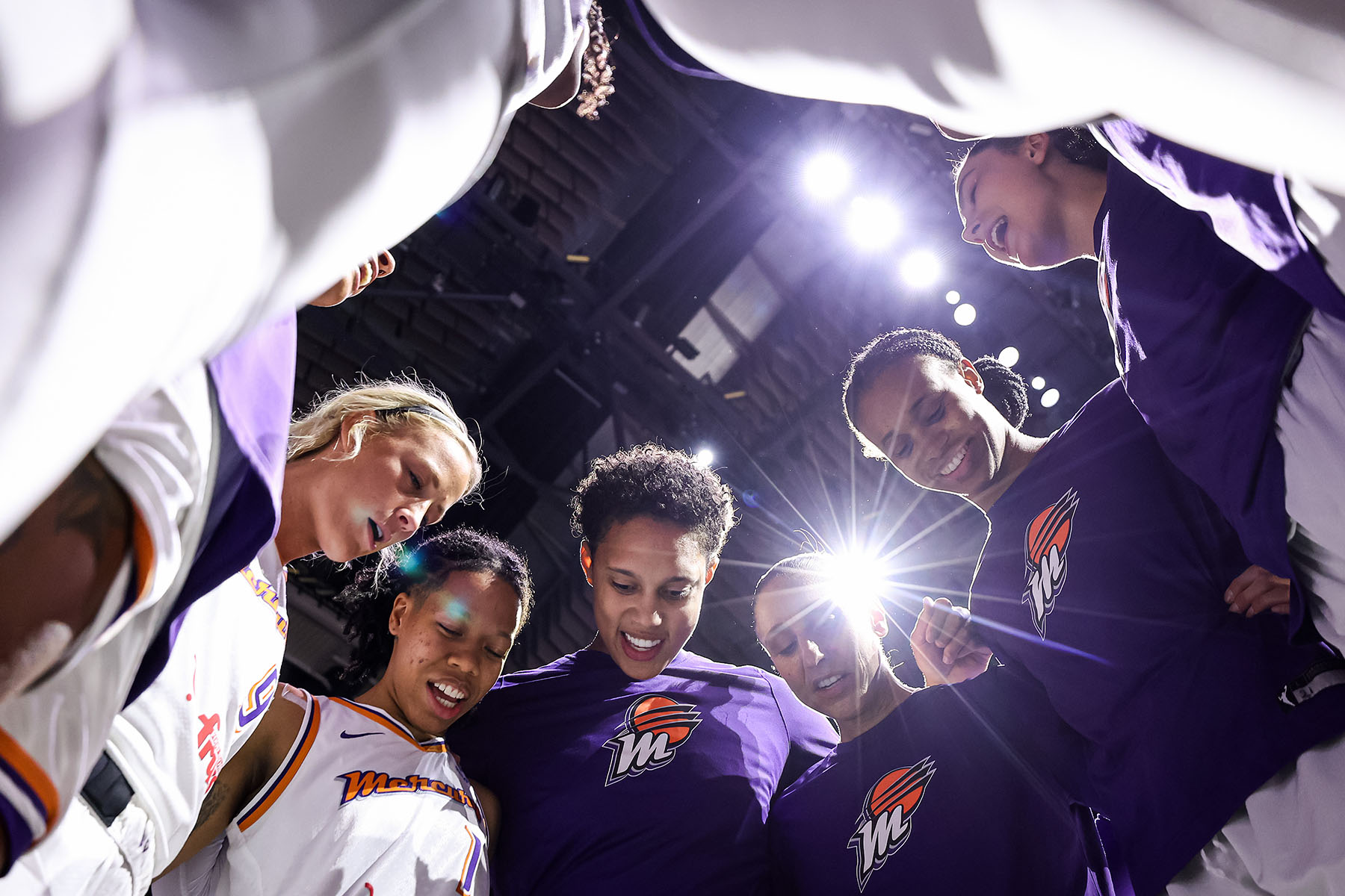 Brittney Griner and Diana Taurasi of the Phoenix Mercury gather their teammates for a huddle before a game.