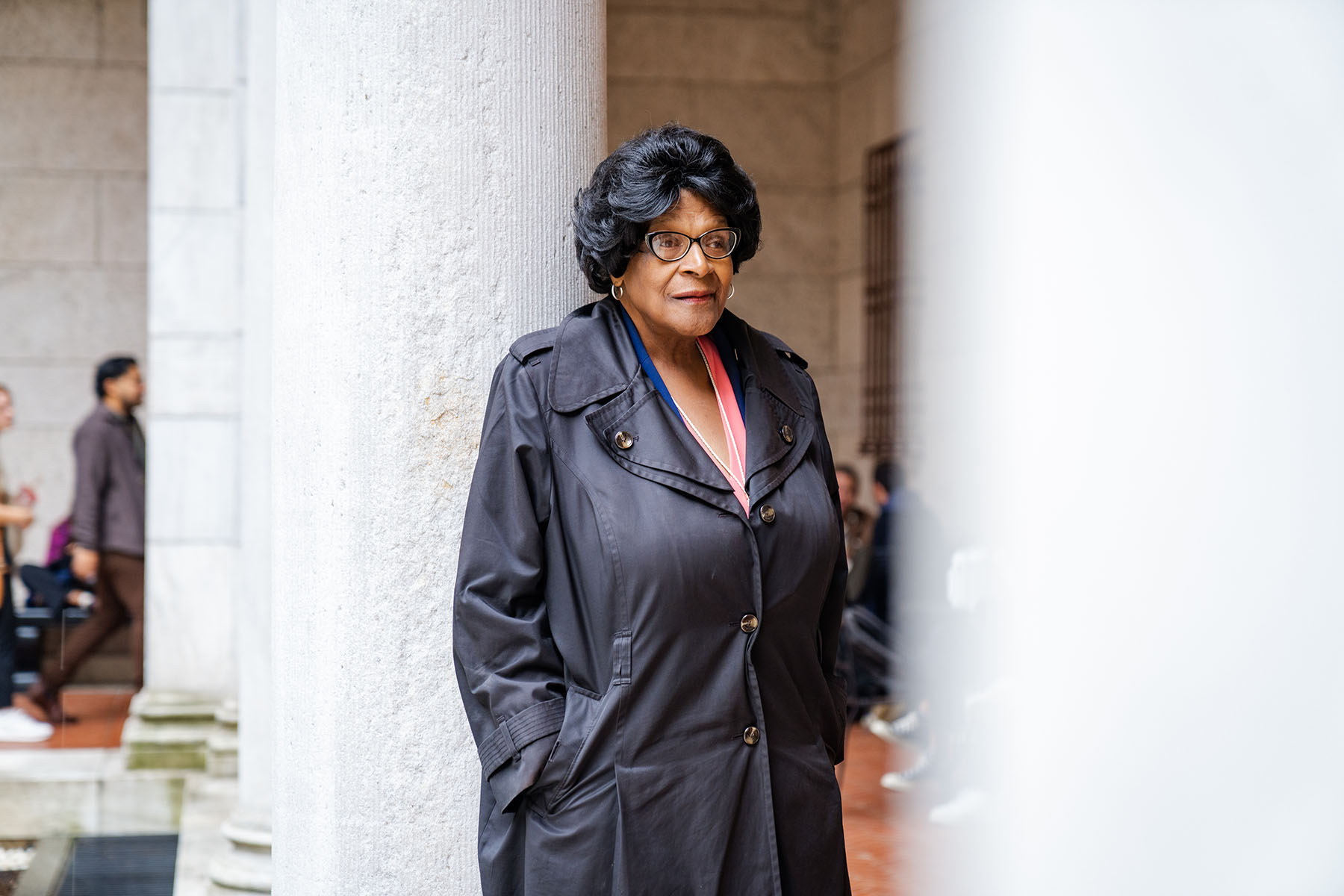 Althea Garrison looks on while posing for a portrait at the Boston Public Library.