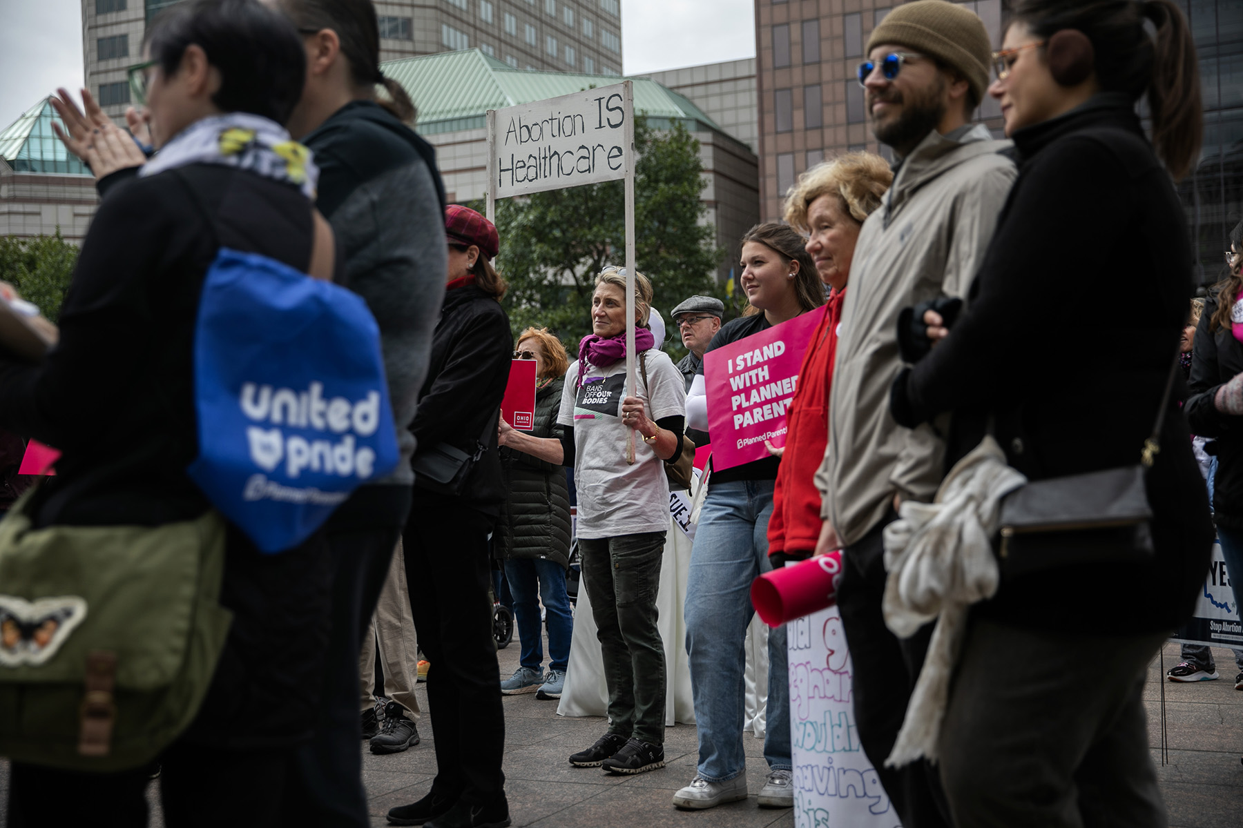 People attend a rally hosted by Ohioans United for Reproductive Rights outside of the Ohio Statehouse.