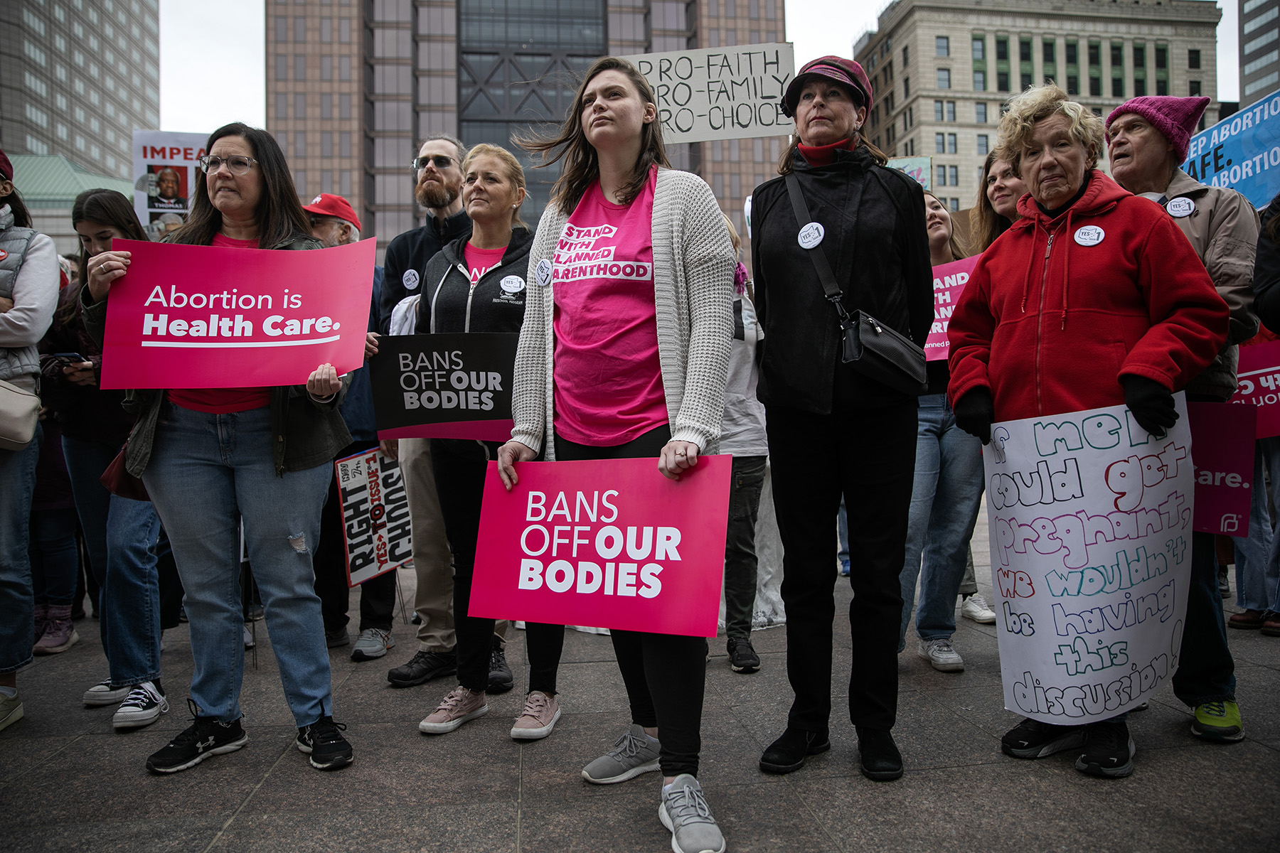 People attend a rally hosted by Ohioans United for Reproductive Rights outside of the Ohio Statehouse.