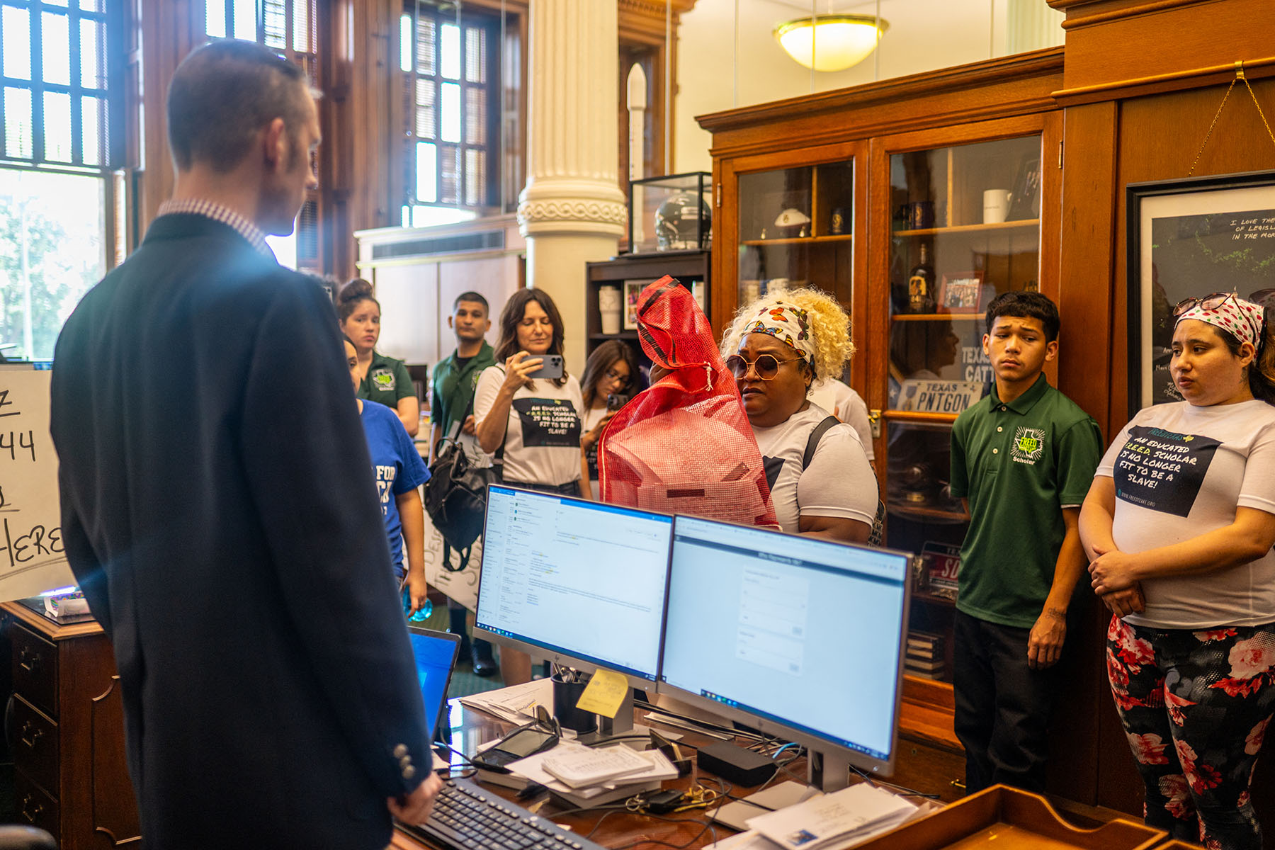 Activists deliver letters from incarcerated people to lawmakers during a visit to the Texas State Capitol.