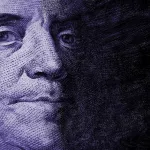 Close up of Benjamin Franklin's face on a hundred dollar bill.