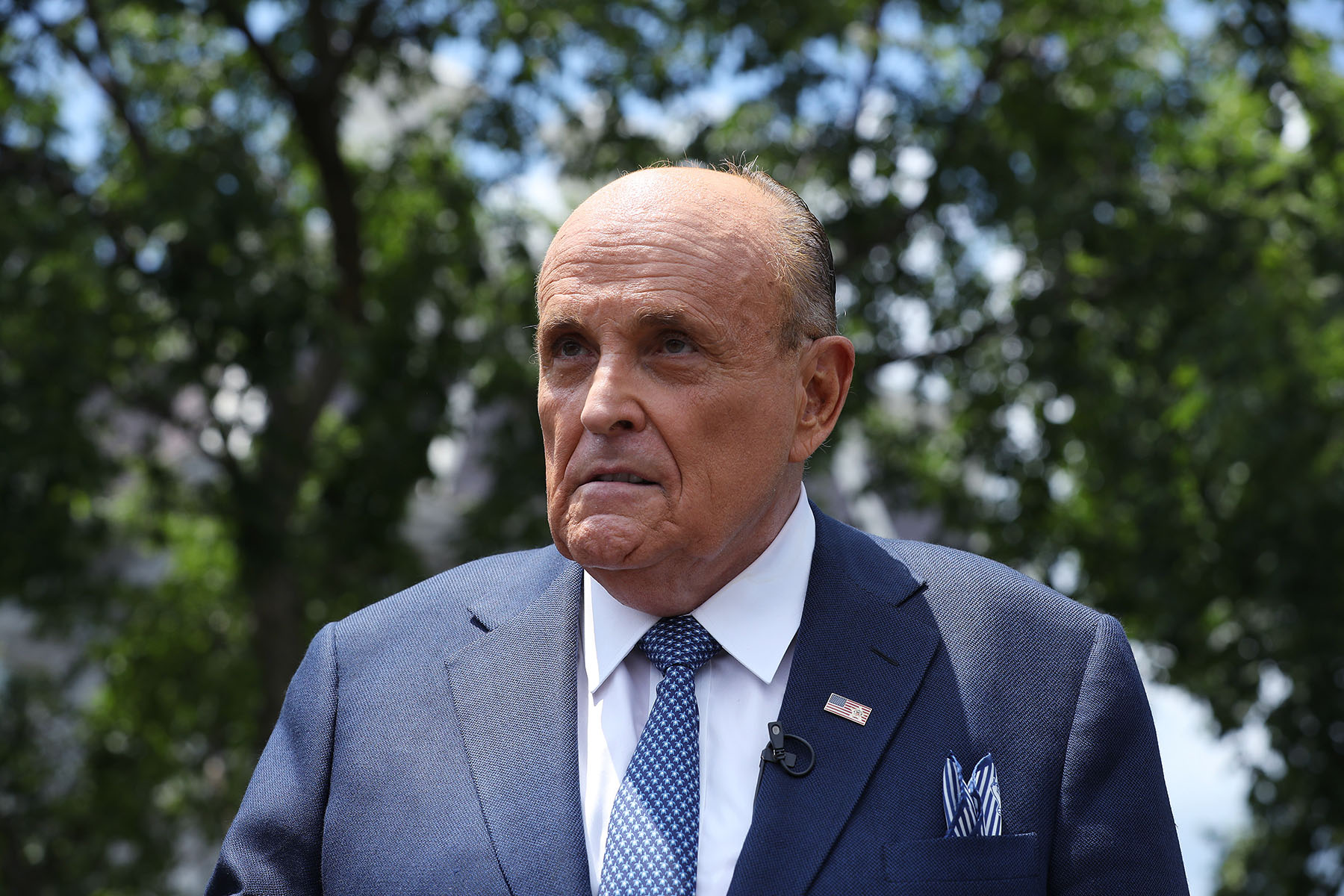 Rudy Giuliani talks to journalists outside the White House West Wing.