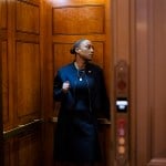Senator Laphonza Butler boards an elevator.