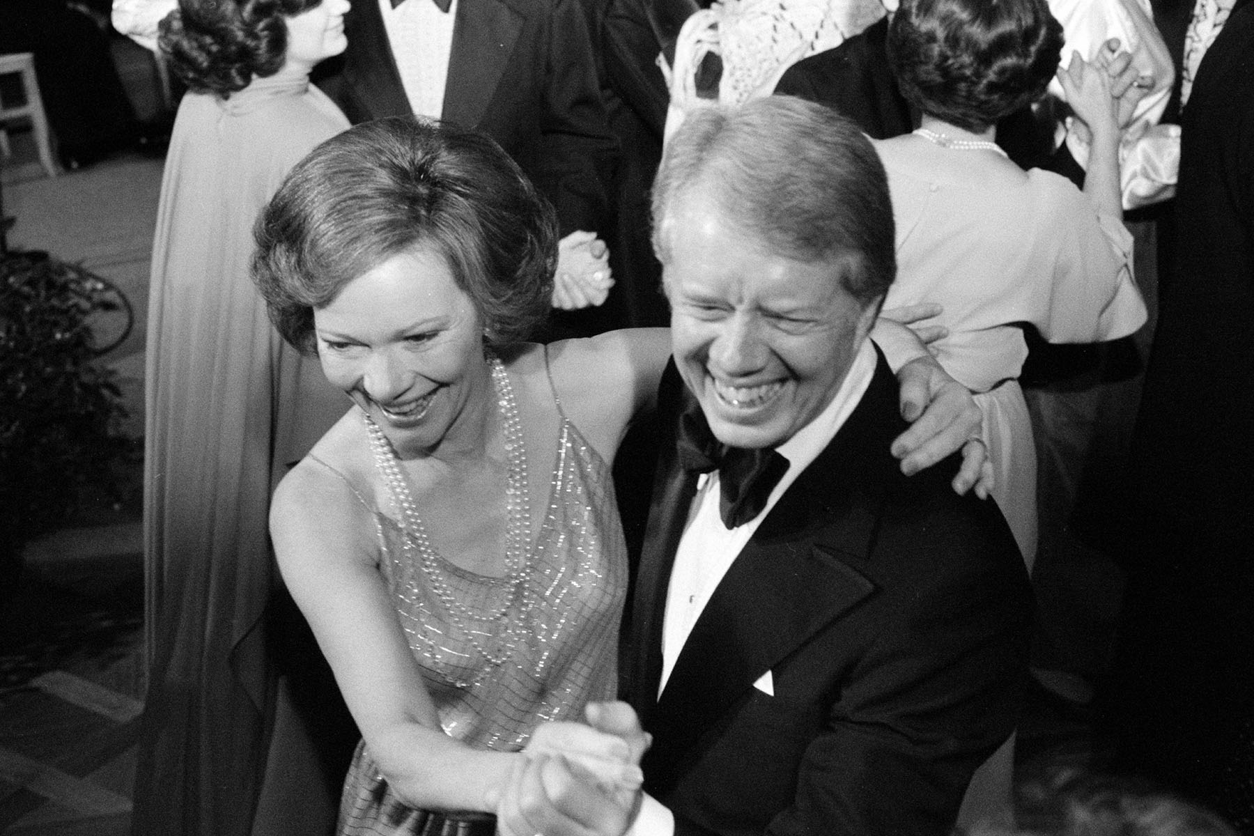 President Jimmy Carter and First Lady Rosalynn Carter dance at a White House Congressional Ball in 1977.