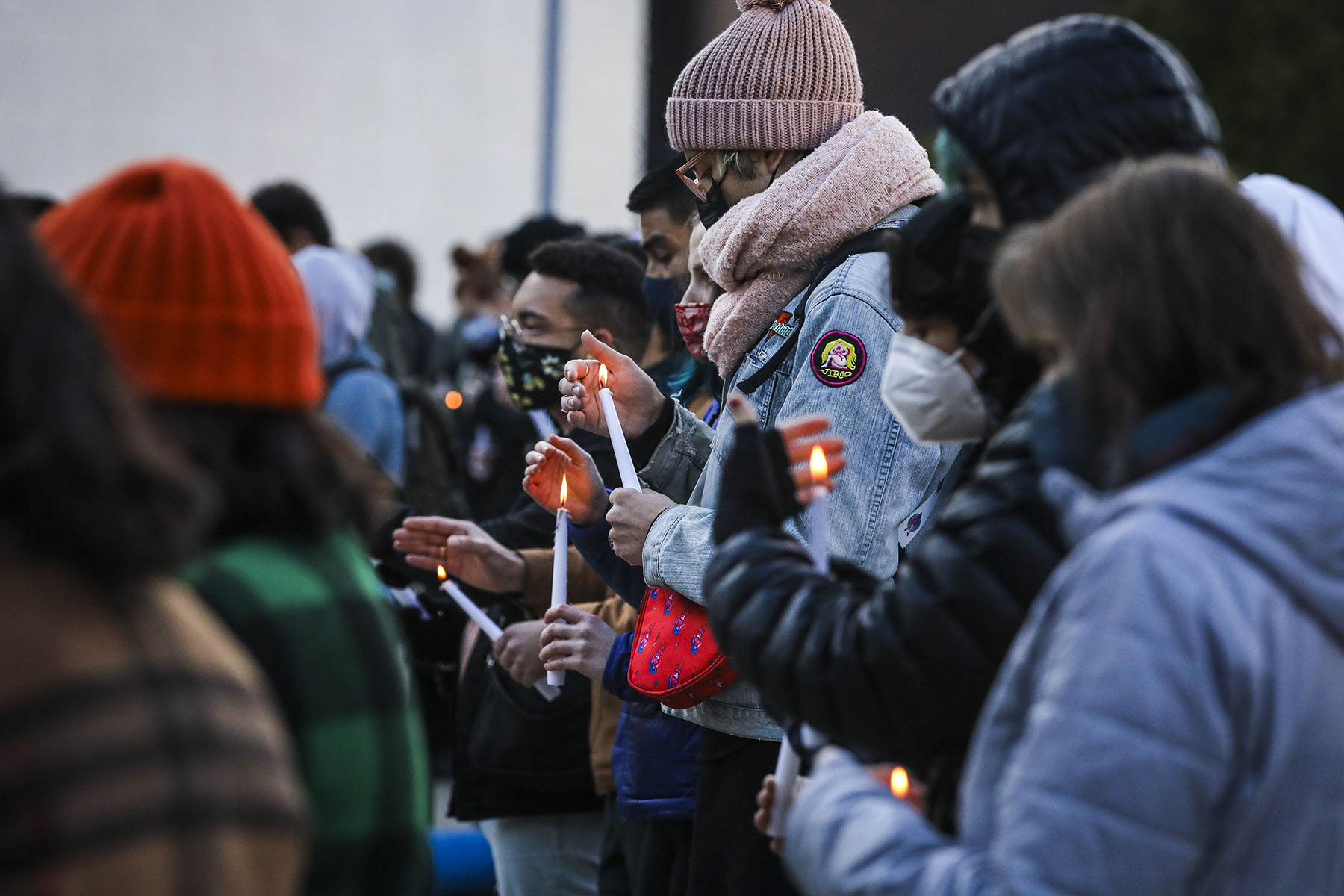 People hold candles as they attend the Transgender Day of Remembrance in Boston.