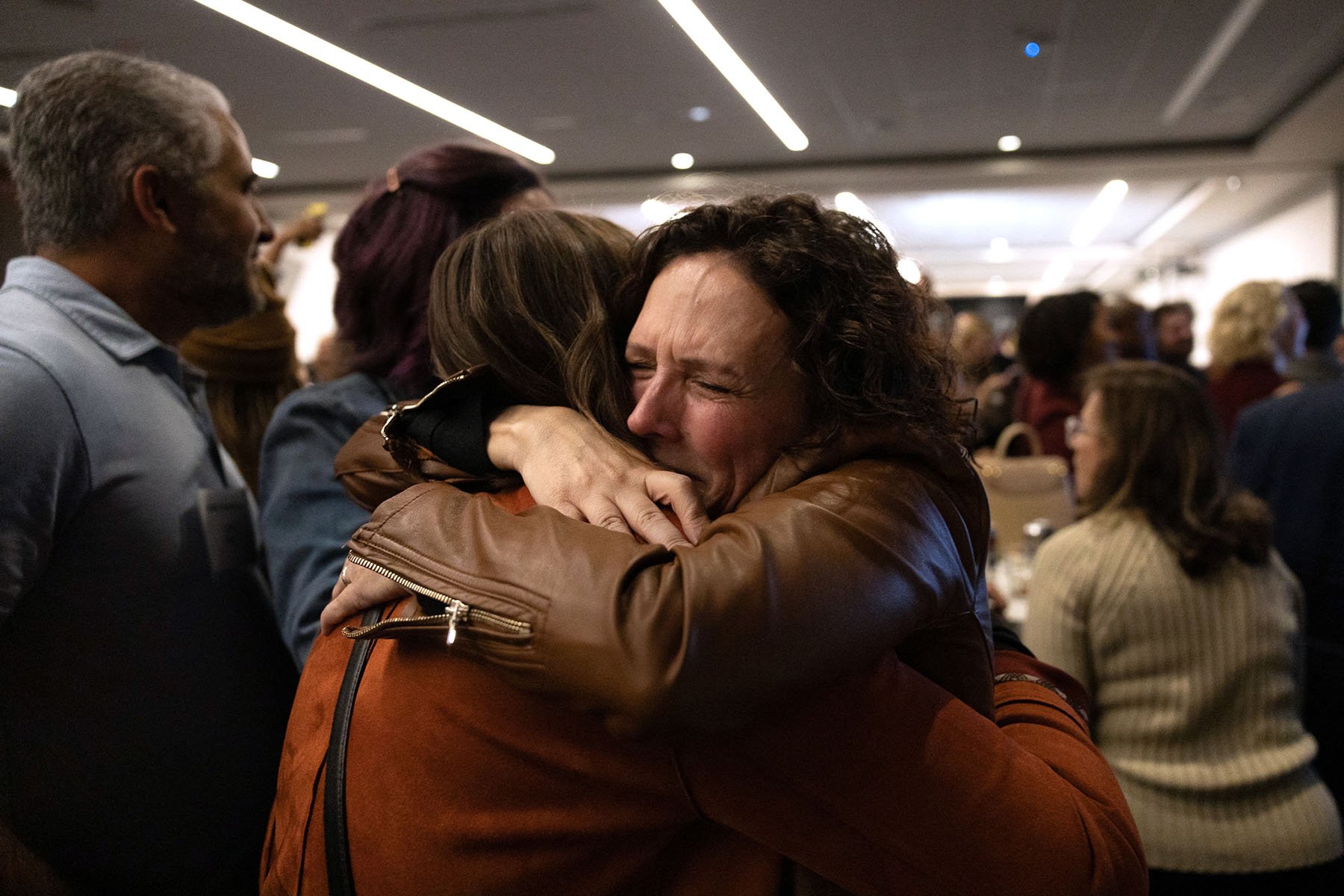 Abortion rights supporters hug as they celebrate winning the referendum on Issue 1 in Columbus, Ohio on November 7, 2023.