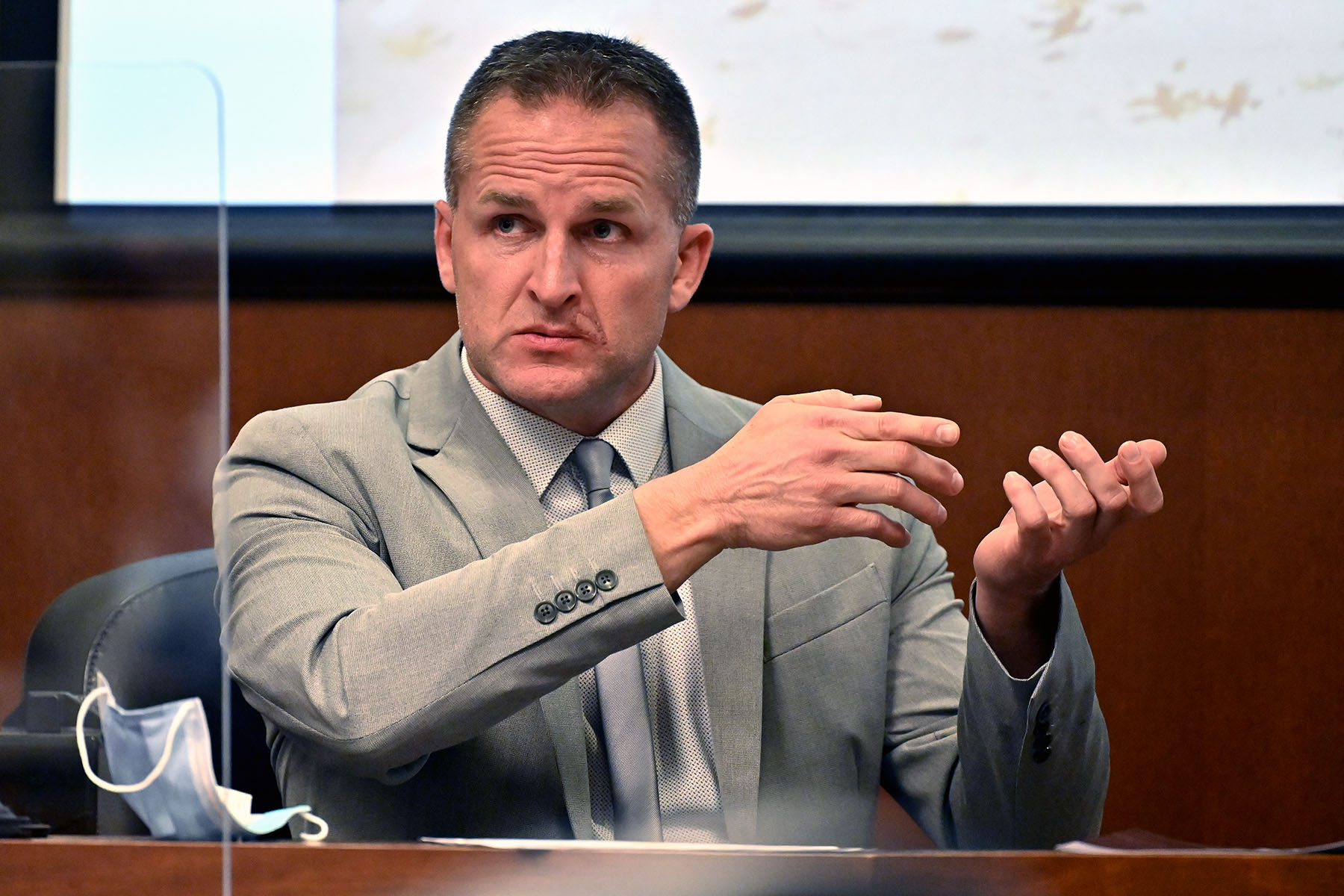 Former Louisville police Officer Brett Hankison gestures as he is cross-examined in court.