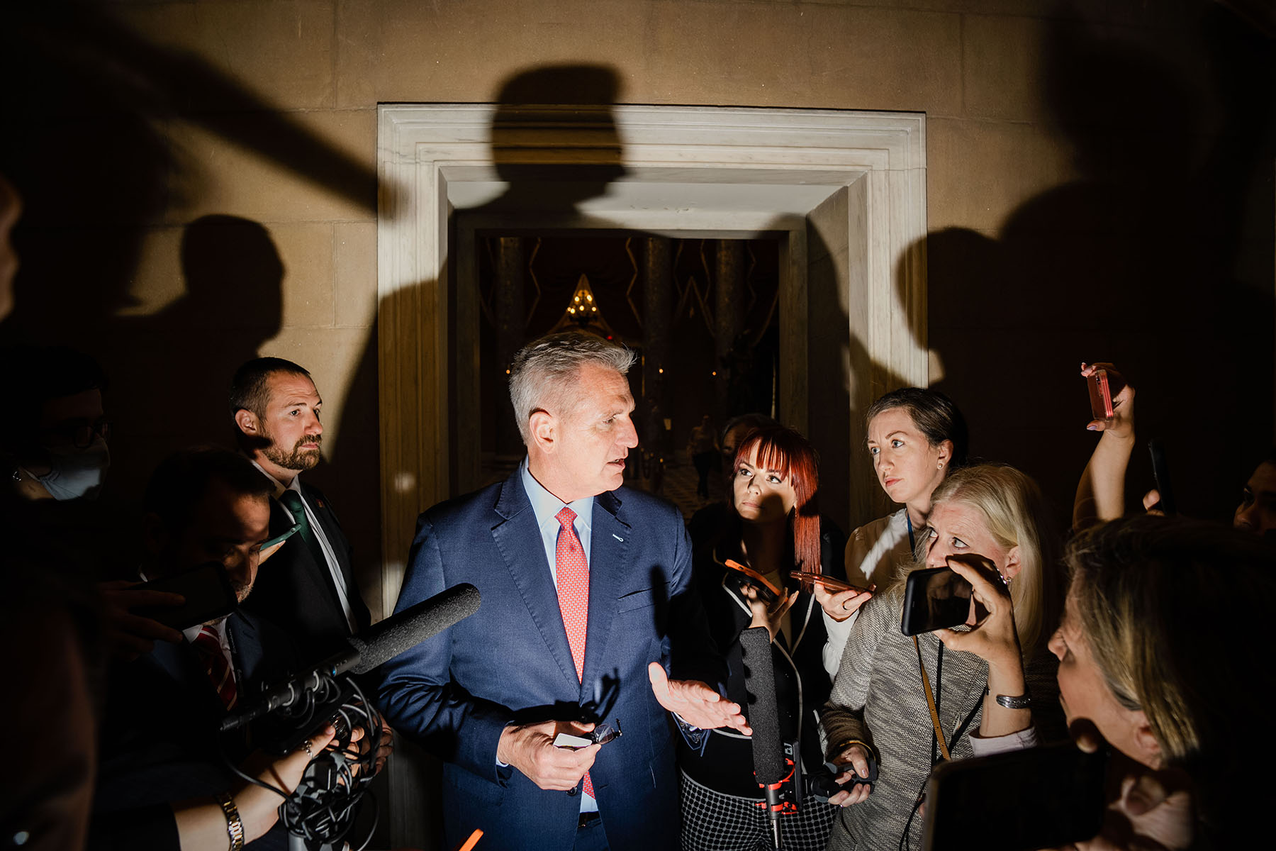 Speaker of the House Kevin McCarthy speaks with reporters as he leaves the House Chamber at the Capitol.