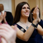 Danica Roem smiles and applauds visitors during opening ceremonies at the start of the 2019 session of the Virginia General Assembly in the House chambers at the Capitol in Richmond, Virginia.