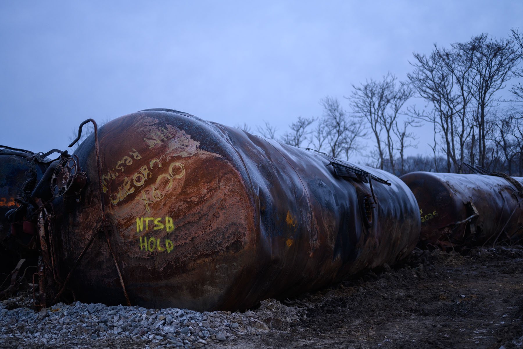 Damaged tanks from the derailed train remain on site in East Palestine, Ohio.
