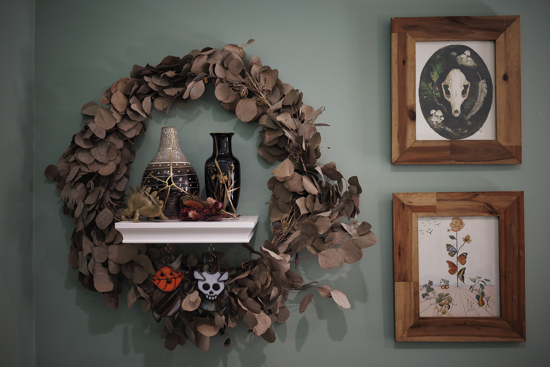 Surrounded by her wedding wreath, urns containing Ann Carver’s son and daughter are seen on a shelf at her home.