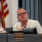 Joseph Komrosky speaks during a school board meeting.