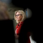 Image of Liz Cheney surrounded by silhouettes as she speaks during a Constitution Day lecture at American Enterprise Institute.